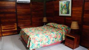 En eller flere senge i et værelse på Ceta Ecotel