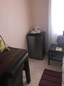 Essence of Africa Guesthouse tesisinde bir oturma alanı