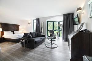Postel nebo postele na pokoji v ubytování Höhen Hotel Viersen