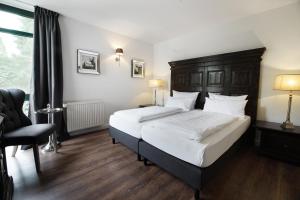 Postel nebo postele na pokoji v ubytování Höhen Hotel Viersen