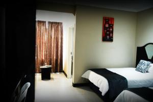 Postel nebo postele na pokoji v ubytování Kismet Hotel