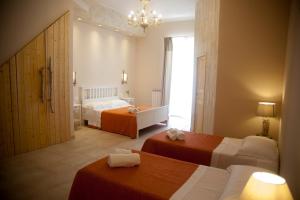 Postel nebo postele na pokoji v ubytování 3 Archi B&B