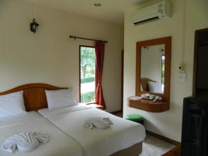 Postel nebo postele na pokoji v ubytování Pai Iyara Resort