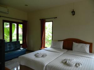 Postel nebo postele na pokoji v ubytování Pai Iyara Resort