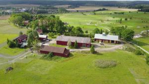 an overhead view of a farm with red barns in a field at Övre Jäder 1 - Jönåker in Jönåker