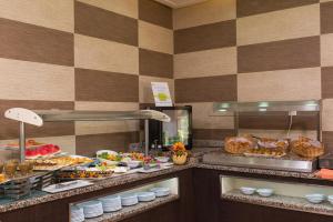 a buffet line with many different types of food at Le Corail Suites Hotel in Tunis