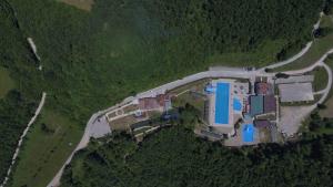 an aerial view of a large house on a hill at Motel "KULA" in Cazin