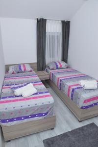 Postelja oz. postelje v sobi nastanitve Atina Lux Hostel