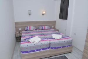 Postelja oz. postelje v sobi nastanitve Atina Lux Hostel