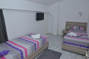 Postelja oz. postelje v sobi nastanitve Atina Lux Hostel