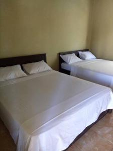 Postel nebo postele na pokoji v ubytování Syifa Homestay