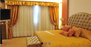 Voodi või voodid majutusasutuse Alkazar Hotel toas