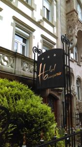 a sign for a hotel in front of a building at Hotel de l'Orangerie in Strasbourg