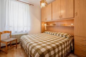 Postel nebo postele na pokoji v ubytování Appartamenti Kratter Sara