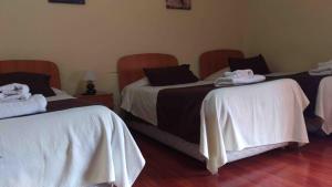 Postel nebo postele na pokoji v ubytování Hostal Sol de Atacama