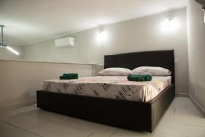 מיטה או מיטות בחדר ב-Casa Toto'