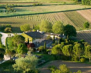 an aerial view of a house in the middle of a field at La Bastide de Marie, Maisons et Hôtels Sibuet in Ménerbes