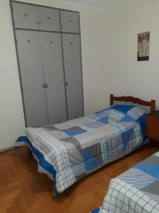 Katil atau katil-katil dalam bilik di Apartamento Lautaro