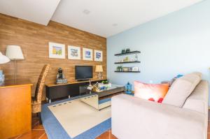 a living room with a couch and a desk at Near beach and Oporto in Vila Nova de Gaia