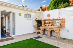 a brick fireplace on the side of a house at Near beach and Oporto in Vila Nova de Gaia