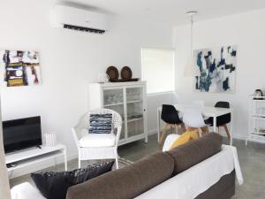 a living room with a couch and a table at Country House Villas Santarém in Santarém