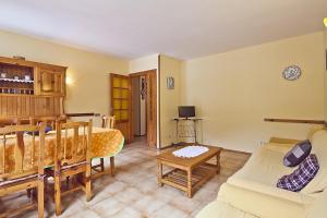 a living room with a couch and a table at Apartamentos Salardu II in Salardú