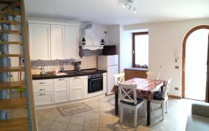 A kitchen or kitchenette at Marmot Apartment