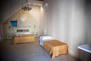 Postel nebo postele na pokoji v ubytování 3 Archi B&B