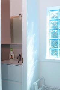 a bathroom with a sink and a mirror at Giovanni House in Alghero