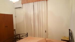 Un pat sau paturi într-o cameră la Borgo Saraceno