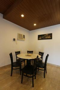 a dining room with a table and chairs at Bee's Homestay in George Town