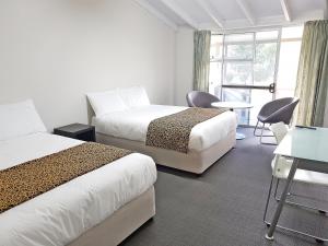 Tempat tidur dalam kamar di VR Auckland Airport