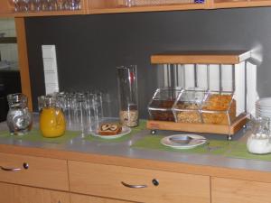 a counter with some food and glasses on it at Gästehaus Ehweiner in Pöls