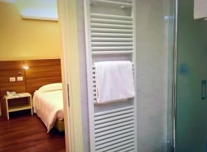 Voodi või voodid majutusasutuse Hotel Forum toas