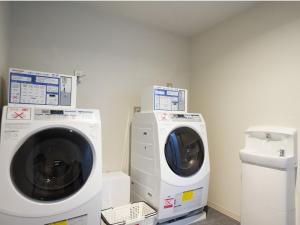 a washing machine and a dryer in a room at Hotel La'gent Plaza Hakodate Hokuto in Hokuto +79 photos