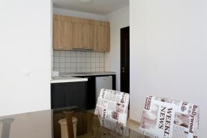 A kitchen or kitchenette at St. Stefan Villas & Hotel