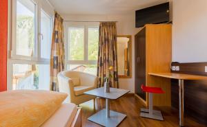 TV a/nebo společenská místnost v ubytování Hotel Blattnerhof
