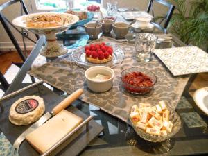 a table with a bunch of food on it at Villa atmosphère à l'ile verte in Grenoble