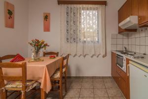 A kitchen or kitchenette at Roula Apartments