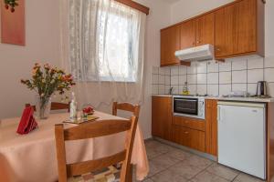 A kitchen or kitchenette at Roula Apartments