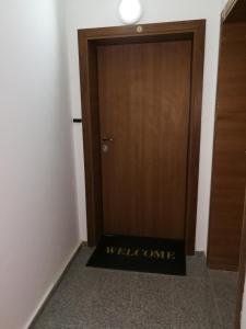 a welcome mat in front of a door at Studio 11 Plovdiv in Plovdiv