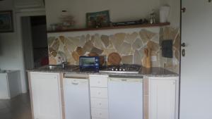 Kjøkken eller kjøkkenkrok på La casetta a due passi dal mare