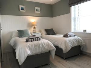 Postel nebo postele na pokoji v ubytování Seaside Cottage