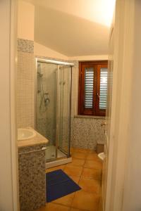 a bathroom with a shower and a sink at Nuova Valmar Villa Condominio Rei Sole in Costa Rei +16 photos