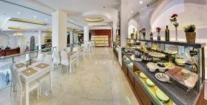 a restaurant with a buffet of food on display at Golden Dune Al faihaa in Riyadh