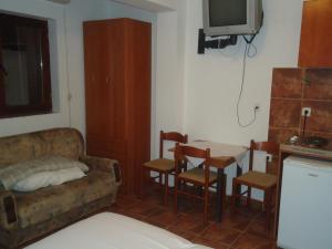 a living room with a couch and a table at Apartments Raičević in Budva