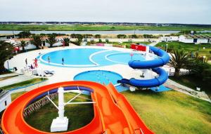 a large water park with a slide and an inflatable at Casa Carmo in Gafanha da Vagueira