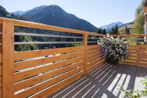 a wooden fence with a view of mountains at Alkira in Sankt Anton am Arlberg