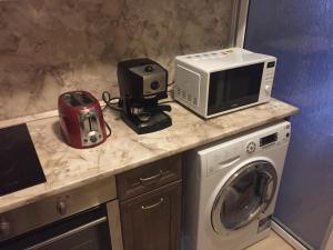 a kitchen counter with a microwave and a toaster at Pirotska Apartment GN / FREE GARAGE in Sofia