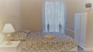 Кровать или кровати в номере La Casa dei Sogni